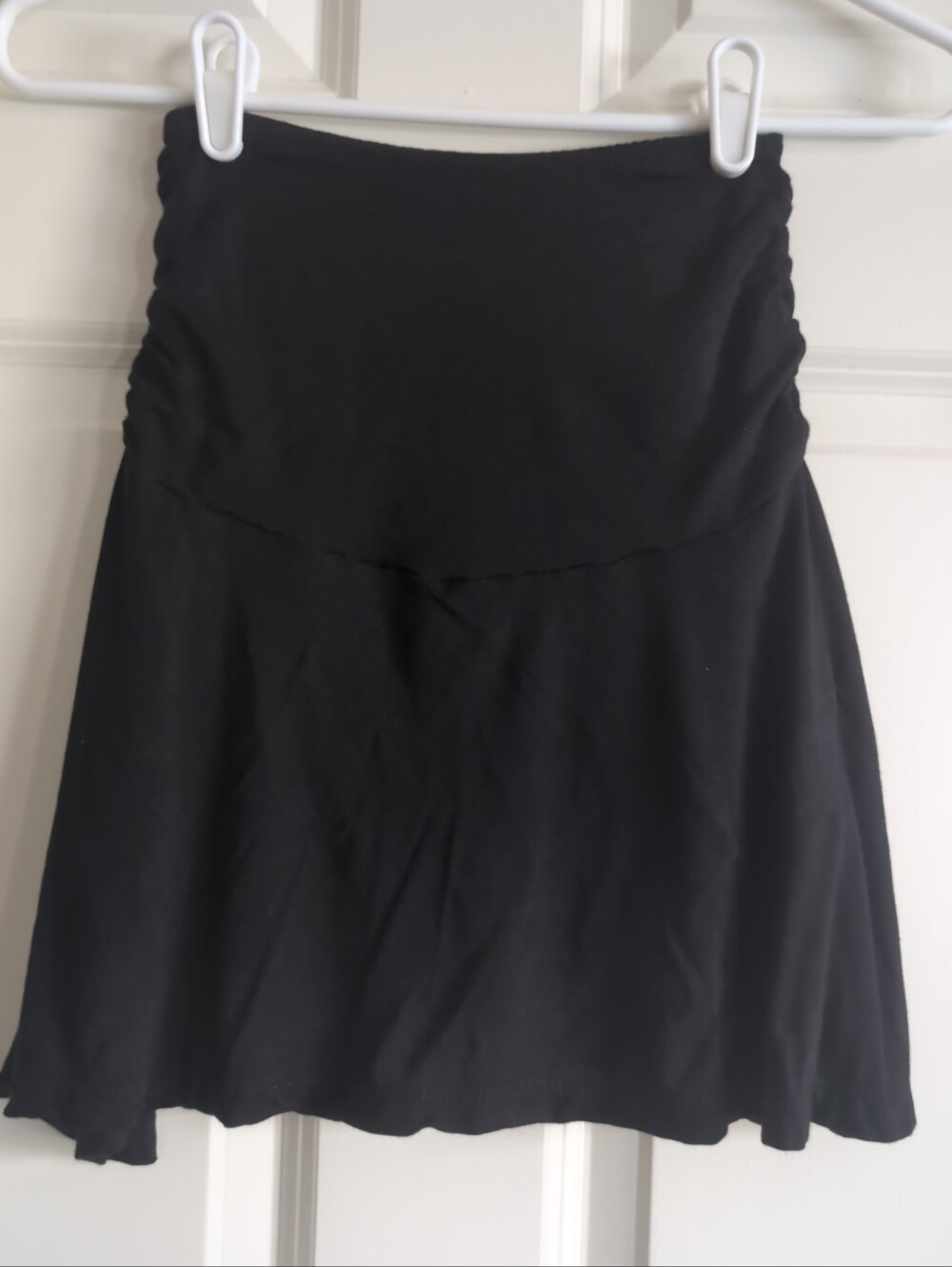 Black rayon spandex ruched mini skirt with shorts and optional fold over waist